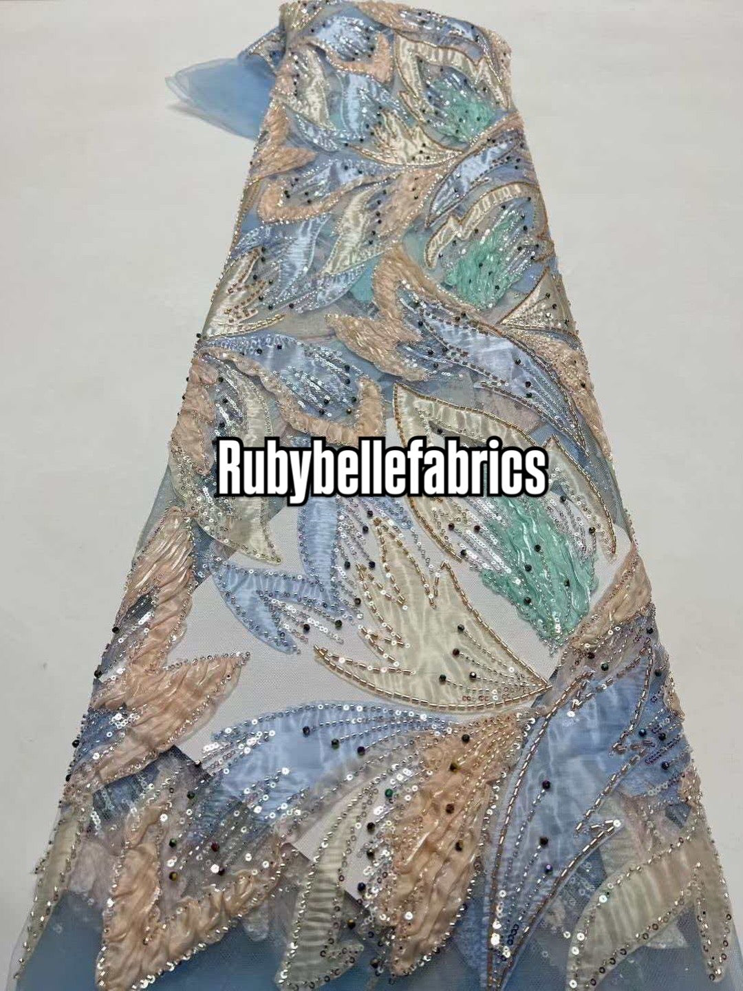 Estic swirling leaf motif couture fabric