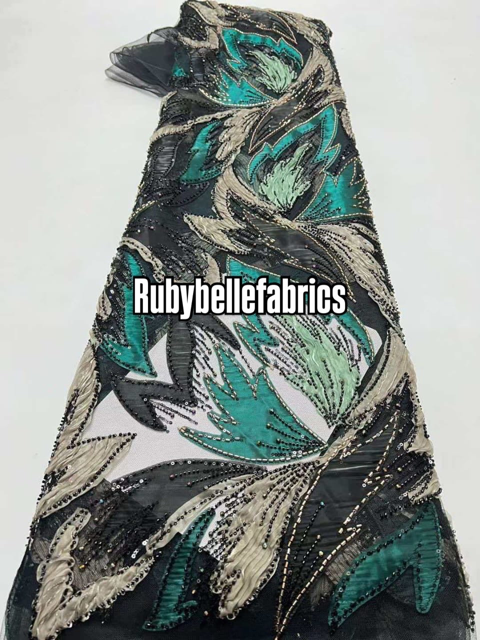 Estic swirling leaf motif couture fabric